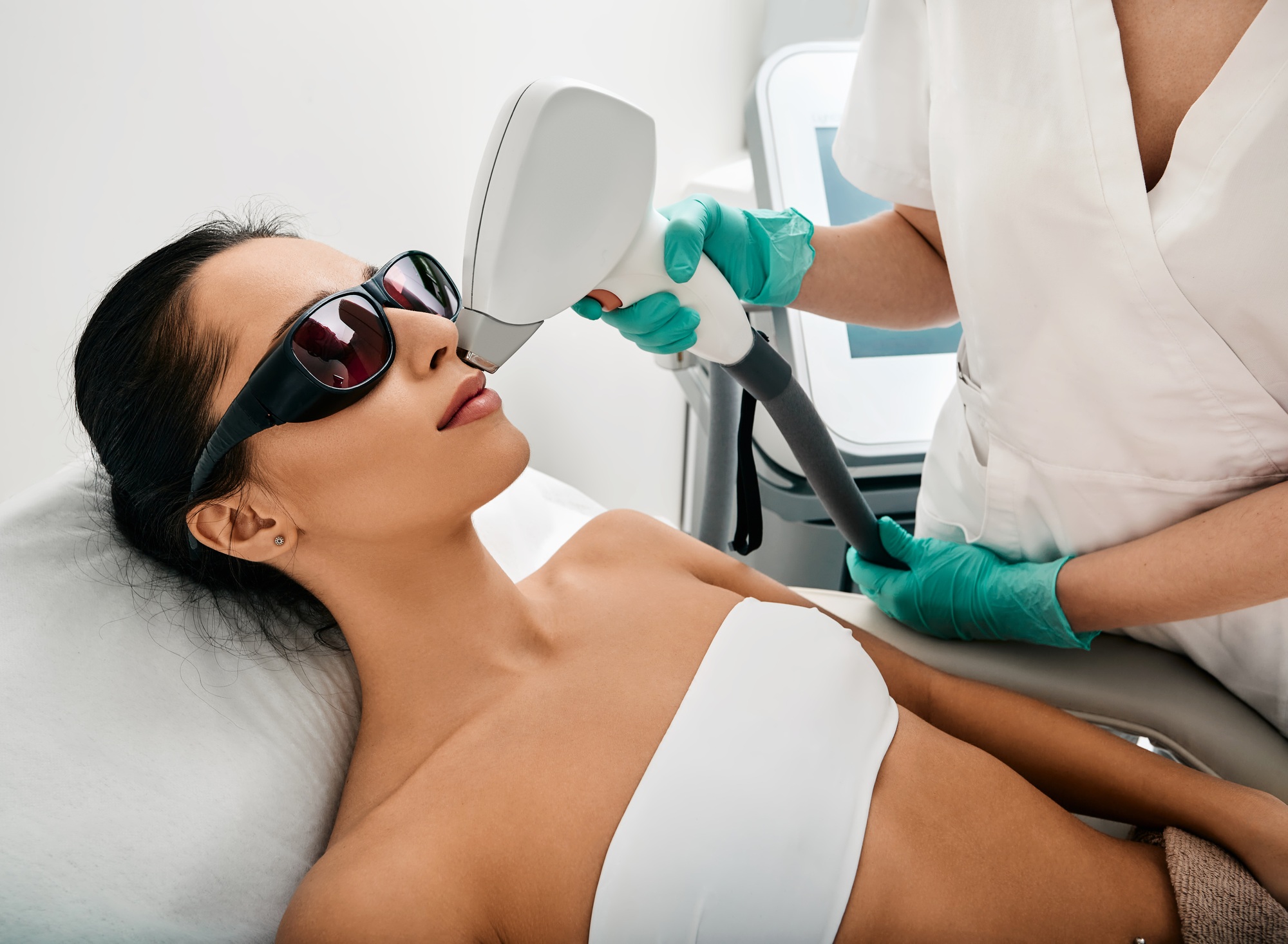 Hair removal over lips. Woman during a laser hair removal procedure and female mustache removal