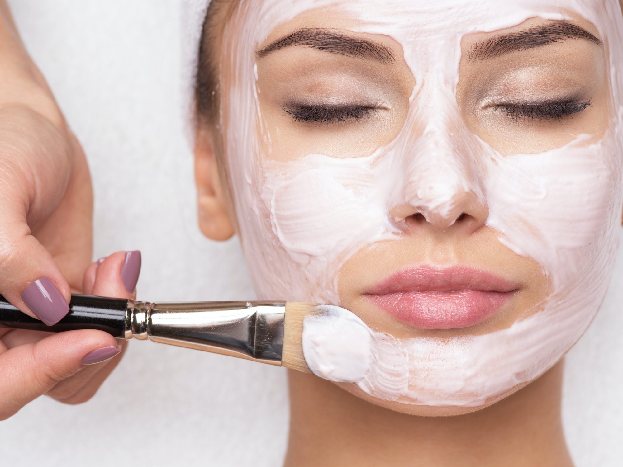 woman-receiving-facial-mask-at-beauty-salon.jpg